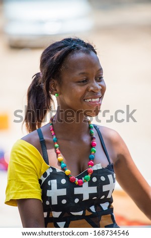 ANGOLA, LUANDA - MARCH 4, 2013:  Angolan beautiful woman dances the national falk dance in Angola, Mar 4, 2013. Music is one of the main African entertainments.