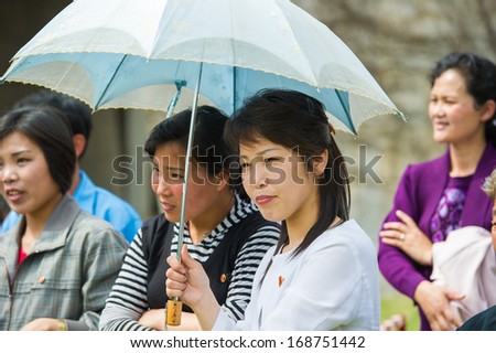 NORTH KOREA - MAY 1, 2012: Korean people watch the public games due to the celebration of the International Worker\'s Day in N.Korea, May 1, 2012. May 1 is a national holiday in 80 countries