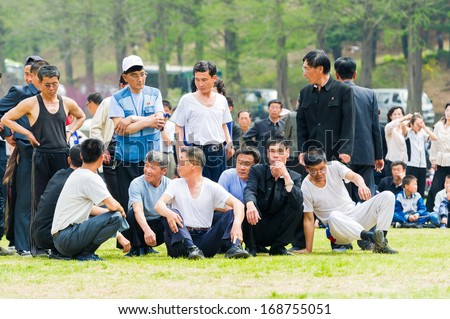 NORTH KOREA - MAY 1, 2012: Korean people prepare for the tug of war game during the celebration of the International Worker\'s Day in N.Korea, May 1, 2012. May 1 is a national holiday in 80 countries