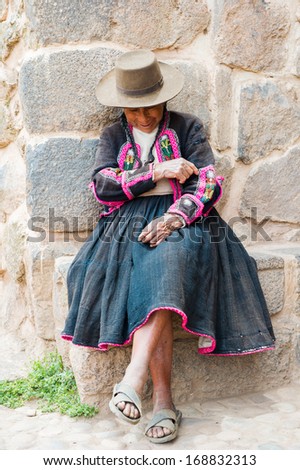 PERU - NOVEMBER 6, 2010: Unidentified Peruvian woman wearing traditional bright clothes in Peru, Nov 6, 2010. Over 50 per cent of people in Peru live below the the poverty line.