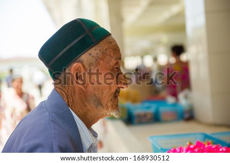 UZBEKISTAN - JUNE 4, 2011: Portrait of unidentified Uzbek man with turban in Uzbekistan, Jun 4, 2011. People of Uzbekistan suffer from the summer heat (38-40 C).