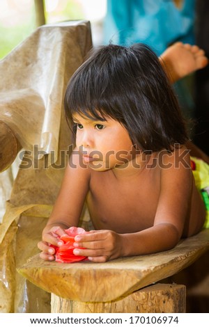 EMBERA VILLAGE, PANAMA, JANUARY 9, 2012: Unidentified native Indian children of Indian reservation in Panama, Jan 9, 2012. Indian reservation is a way to conserve native culture, languange, traditions