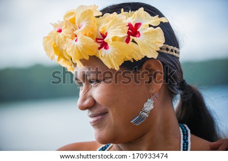EMBERA VILLAGE, PANAMA, JANUARY 9, 2012: Portrait of an unidentified native Indian woman with flowers in Panama, Jan 9, 2012. Embera village is the Indian reservation in Panama