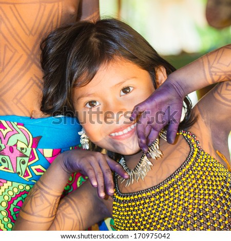 EMBERA VILLAGE, PANAMA, JANUARY 9, 2012: Portrait of an unidentified native Indian girl smiling for the camera in Panama, Jan 9, 2012. Indian reservation is the way to conserve native culture