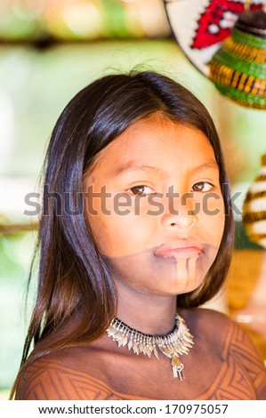 EMBERA VILLAGE, PANAMA, JANUARY 9, 2012: Portrait of an unidentified native Indian girl in Panama, Jan 9, 2012. Indian reservation is the way to conserve native culture