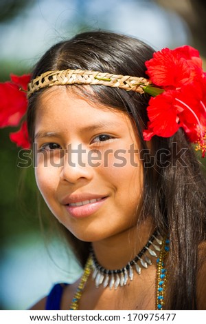EMBERA VILLAGE, PANAMA, JANUARY 9, 2012: Portrait of an unidentified native Indian girl with flowers on her head  in Panama, Jan 9, 2012. Embera village is the Indian reservation in Panama