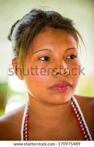 EMBERA VILLAGE, PANAMA, JANUARY 9, 2012: Portrait of an unidentified native Indian woman wearing the bead in Panama, Jan 9, 2012. Embera village is the Indian reservation in Panama