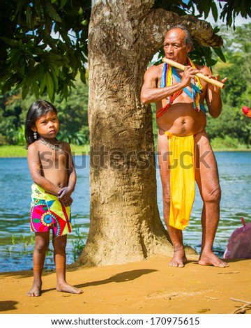 Embera Village, Panama, January 9, 2012: Unidentified Native Indian People Make Music For The Tourists In Panama, Jan 9, 2012. Indian Reservation Is The Way To Conserve Native Culture, Traditions