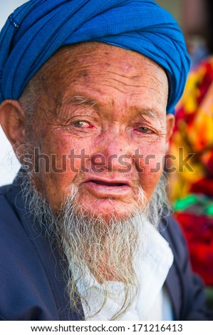 SAMARKAND, UZBEKISTAN - JUNE 10, 2011: Portrait of unidentified Uzbek man with beard and turban in Uzbekistan, Jun 10, 2011. 93% of Uzbek people consider that life in the country goes well.