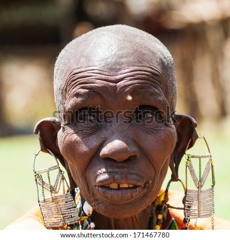KENYA - OCTOBER 10, 2009: Portrait of an unidentified Massai extraordinary woman with heavy earings in Kenya, Oct 10, 2009. Massai people are a Nilotic ethnic group
