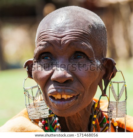 KENYA - OCTOBER 10, 2009: Portrait of an unidentified Massai extraordinary woman with heavy earings in Kenya, Oct 10, 2009. Massai people are a Nilotic ethnic group