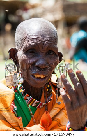 AMBOSELI, KENYA - OCTOBER 10, 2009: Portrait of an unidentified Massai extraordinary woman with heavy earings in Kenya, Oct 10, 2009. Massai people are a Nilotic ethnic group
