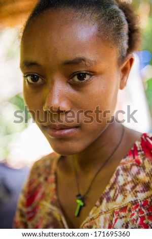 OMO VALLEY, ETHIOPIA - SEP 20, 2011: Unidentified Ethiopian shy girl looks surrendered in Ethiopia, Sep.20, 2011. People in Ethiopia suffer of poverty due to the unstable situation