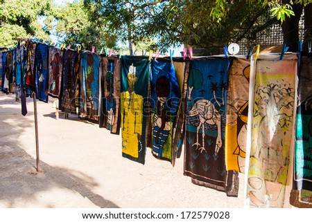 BANJUL, GAMBIA - MAR 14, 2013: Unidentified Gambian women wash the clothes in the street in Gambia, Mar 14, 2013. Major ethnic group in Gambia is the Mandinka - 42%