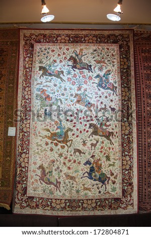 Isfahan, Iran - Jan 7, 2014: Persian Carpet On The Wall Of A Shop In Iran, Jan 7, 2014. Persian Carpet Is An Important Part Of Persian Art And Culture.
