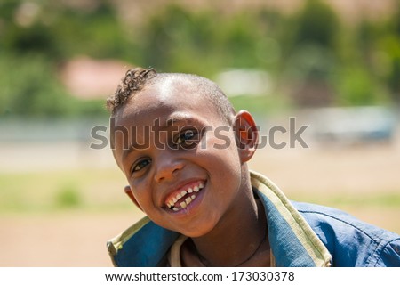 AKSUM, ETHIOPIA - SEP 24, 2011: Unidentified Ethiopian cute little boy with a funny haircut in Ethiopia, Sep.24, 2011. Children in Ethiopia suffer of poverty due to the unstable situation