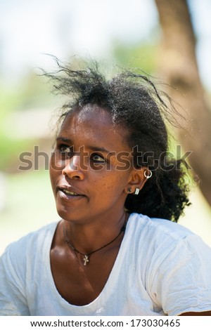 AKSUM, ETHIOPIA - SEP 24, 2011: Unidentified Ethiopian beautiful girl wearing white clothes in Ethiopia, Sep.24, 2011. Children in Ethiopia suffer of poverty due to the unstable situation