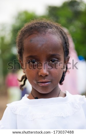 AKSUM, ETHIOPIA - SEP 27, 2011: Portrait of an unidentified Ethiopian child wearing old clothes in Ethiopia, Sep.27, 2011. Children in Ethiopia suffer of poverty due to the unstable situation
