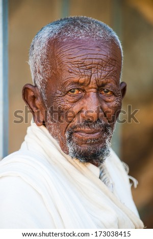 AKSUM, ETHIOPIA - SEP 24, 2011: Unidentified Ethiopian man with white beard in Ethiopia, Sep.24, 2011. Children in Ethiopia suffer of poverty due to the unstable situation