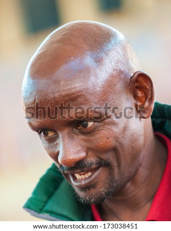 AKSUM, ETHIOPIA - SEP 24, 2011: Unidentified Ethiopian man in green jacket in Ethiopia, Sep.24, 2011. People in Ethiopia suffer of poverty due to the unstable situation