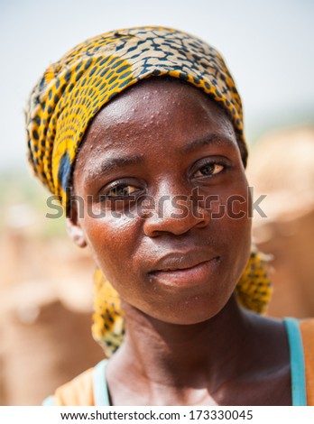 KARA, TOGO - MARCH 7, 2012: Unidentified Togolese woman in traditional clothes in Togo, Mar 7, 2012. People in Togo suffer of poverty due to unstable economical situation