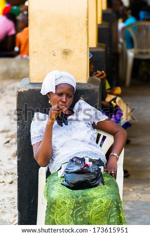 KARA, TOGO - MARCH 11, 2012: Unidentified Togolese woman sits and thinks in Togo, Mar 11, 2012. People in Togo suffer of poverty due to unstable economical situation