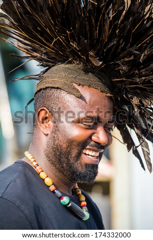 LIBREVILLE, GABON - MAR 6, 2013: Unidentified Gabonese man with incredibly huge and funny hair cut in Gabon, Mar 6, 2013. People of Gabon suffer of poverty due to the unstable economical situation