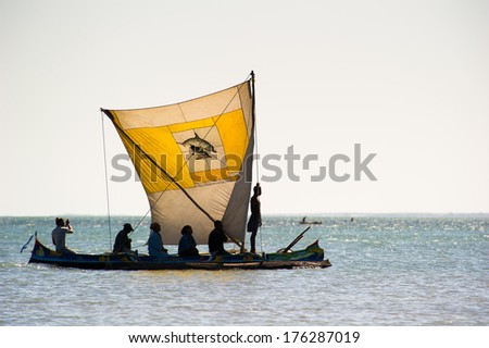 ANTANANARIVO, MADAGASCAR - JULY 3, 2011: Unidentified Madagascar people on a small boat. People in Madagascar suffer of poverty due to slow development of the country