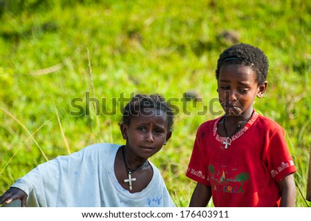 OMO, ETHIOPIA - SEPTEMBER 20, 2011: Unidentified Ethiopian girl and boy crying. People in Ethiopia suffer of poverty due to the unstable situation