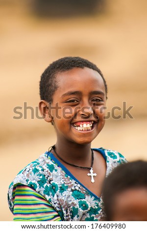 OMO, ETHIOPIA - SEPTEMBER 22, 2011: Unidentified Ethiopian smiling little boy. People in Ethiopia suffer of poverty due to the unstable situation