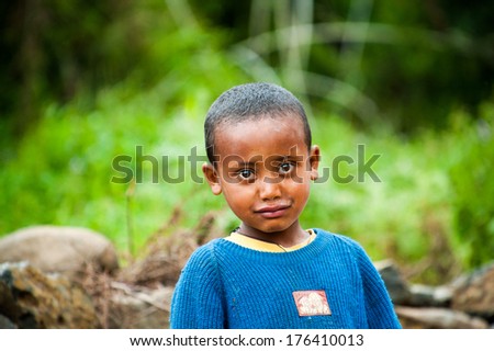 Omo, Ethiopia - September 22, 2011: Unidentified Ethiopian Cute Little Boy Smiles Wearing The Blue Jersey. People In Ethiopia Suffer Of Poverty Due To The Unstable Situation