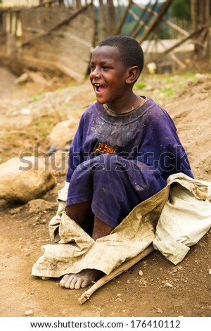 OMO, ETHIOPIA - SEPTEMBER 22, 2011: Unidentified Ethiopian man sing a song loudly. People in Ethiopia suffer of poverty due to the unstable situation