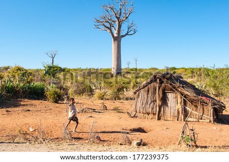 Antananarivo, Madagascar - July 3, 2011: Unidentified Madagascar Children Near A Wooden House. People In Madagascar Suffer Of Poverty Due To Slow Development Of The Country