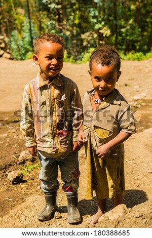 LALIBELA, ETHIOPIA - SEPTEMBER 28, 2011: Unidentified Ethiopian little friends play in the field. People in Ethiopia suffer of poverty due to the unstable situation
