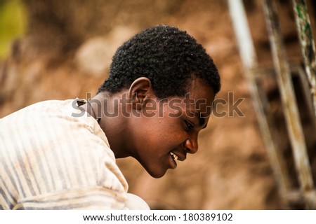 LALIBELA, ETHIOPIA - SEPTEMBER 27, 2011: Unidentified Ethiopian religious man near the Lalibela church cut off the rock. People in Ethiopia suffer of poverty due to the unstable situation