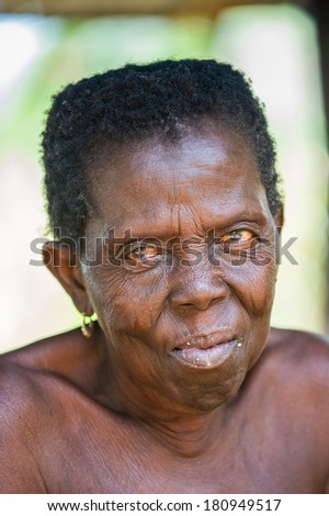 PORTO-NOVO, BENIN - MAR 8, 2012: Portrait of unidentified Beninese sympathic old woman. People of Benin suffer of poverty due to the difficult economic situation.