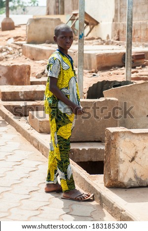 PORTO-NOVO, BENIN - MAR 9, 2012: Unidentified Beninese woman at the local market. People of Benin suffer of poverty due to the difficult economic situation