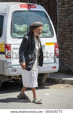 SANA\'A, YEMEN - JAN 11, 2014: Unidentified Yemeni old man in traditional clothes in Sana\'a, Yemen. People in Yemen suffer of poverty due to the unstable political situation.