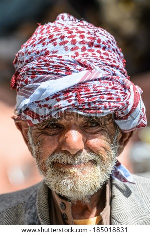 SANA\'A, YEMEN - JAN 11, 2014: Unidentified Yemeni old man in traditional clothes in Sana\'a, Yemen. People in Yemen suffer of poverty due to the unstable political situation.