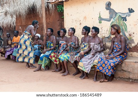 KARA, TOGO - MAR 11, 2012:  Unidentified Togolese women watch the religious voodoo dance performance. Voodoo is the West African religion