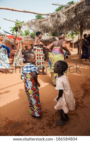 KARA, TOGO - MAR 11, 2012:  Unidentified Togolese children in traditional dress dance the religious voodoo dance. Voodoo is the West African religion