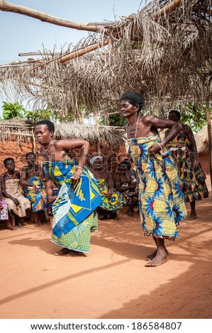 KARA, TOGO - MAR 11, 2012:  Unidentified Togolese women in traditional dress dance the religious voodoo dance. Voodoo is the West African religion