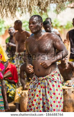 KARA, TOGO - MAR 11, 2012:  Unidentified Togolese man in a traditional clothes dances the religious voodoo dance. Voodoo is the West African religion