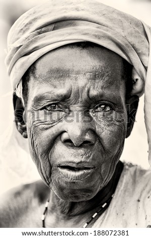 ACCRA, GHANA - MAR 5, 2012: Unidentified Ghanaian old woman sclose up. People of Ghana suffer of poverty due to the difficult economic situation