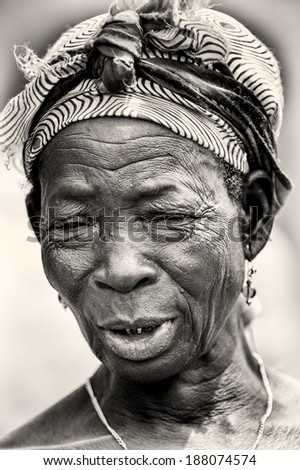 ACCRA, GHANA - MAR 5, 2012: Unidentified Ghanaian old woman close up. People of Ghana suffer of poverty due to the difficult economic situation