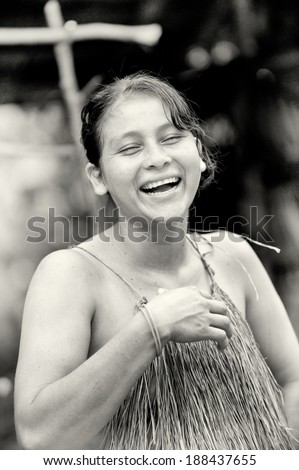 AMAZONIA, PERU - NOV 10, 2010: Unidentified Amazonian indigenous woman laughs. Indigenous people of Amazonia are protected by  COICA (Coordinator of Indigenous Organizations of the Amazon River Basin)