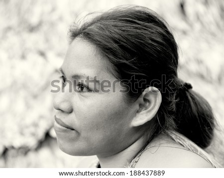 AMAZONIA, PERU - NOV 10, 2010: Unidentified Amazonian indigenous girl portrait. Indigenous people of Amazonia are protected by COICA (Coordinator of Indigenous Organizations of the Amazon River Basin)