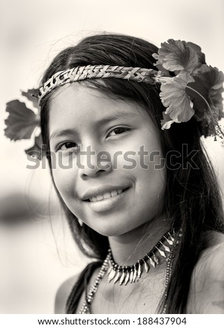 EMBERA VILLAGE, PANAMA, JANUARY 9, 2012: Unidentified native Indian girl with flowers on the hair. Indian reservation is the way to conserve native culture, language, traditions