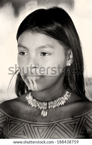 EMBERA VILLAGE, PANAMA, JANUARY 9, 2012: Unidentified native Indian girl with traditional draws in the Indian reservation.Indian reservation is the way to conserve native culture, language, tradition