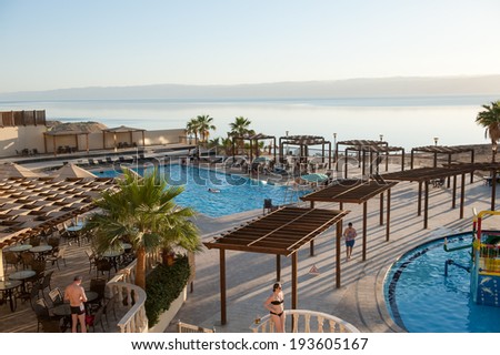 DEAD SEA RESORT, JORDAN - APR 30, 2014: SPA Hotel at the Dead Sea coast in Jordan. Dead Sea water is used for medical purposes for the people with skin problems